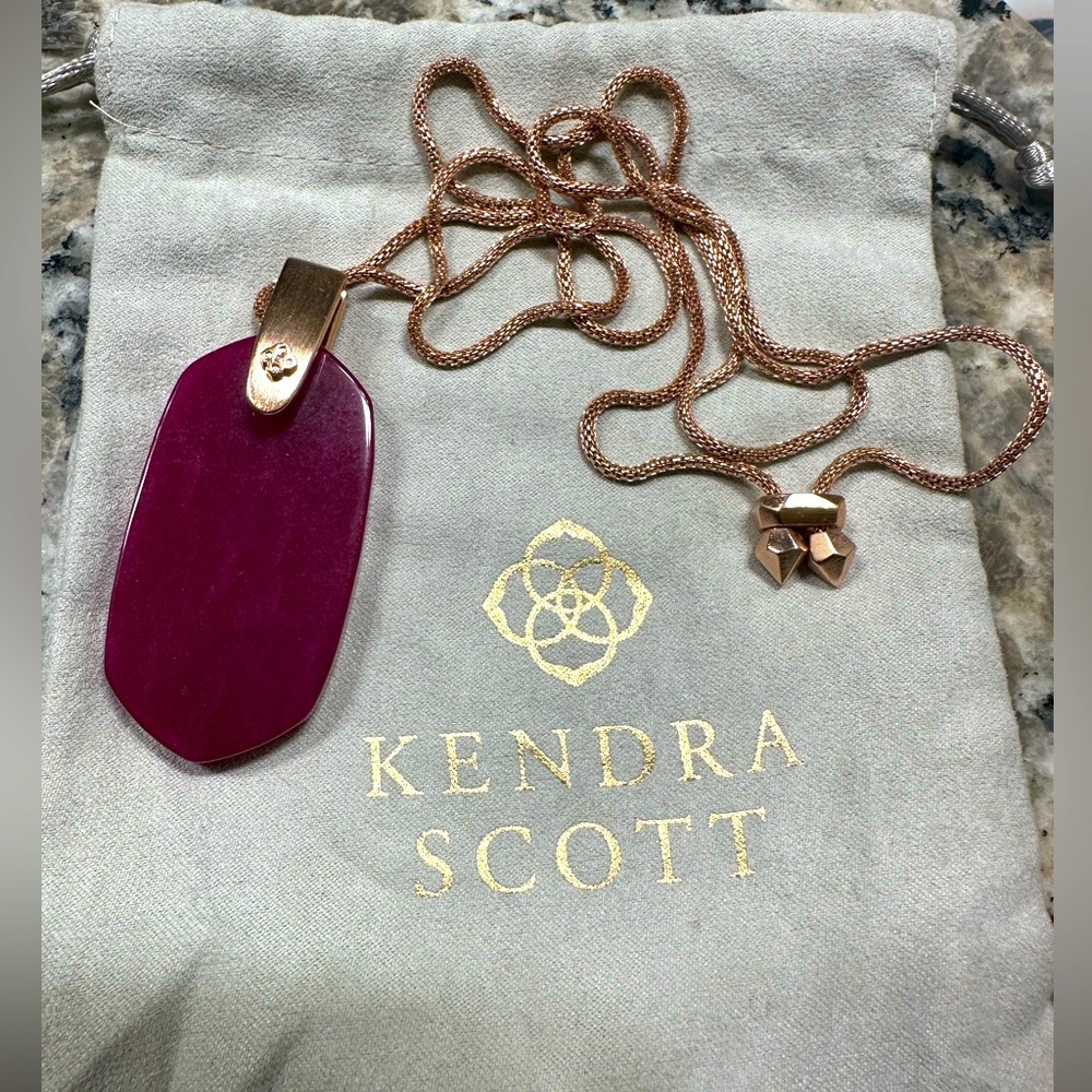 Kendra Scott necklace
Inez rose gold long pendant in maroon jade.